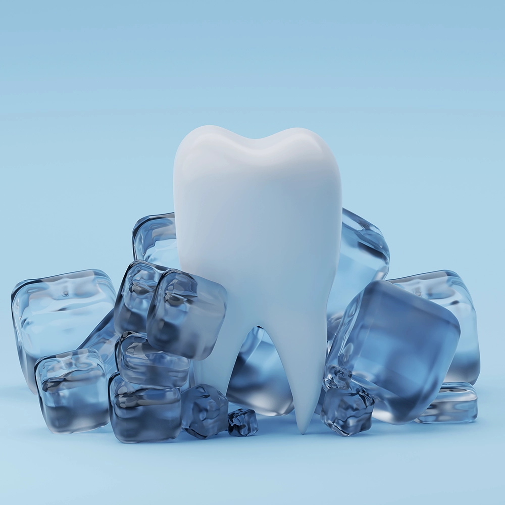 A 3D illustration of a healthy tooth surrounded by translucent ice cubes, symbolizing tooth sensitivity and the need for urgent dental care.