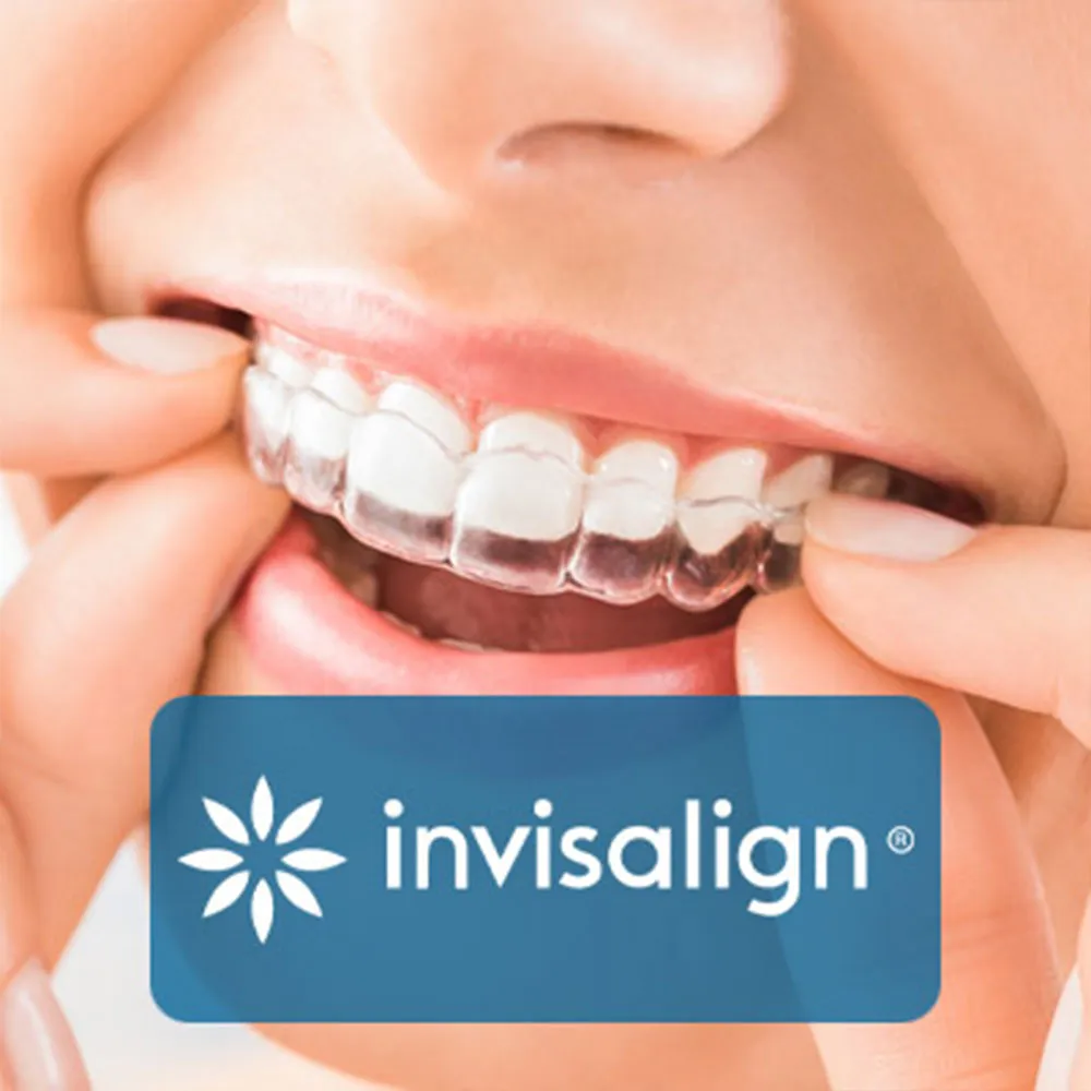 A close-up of a person fitting an Invisalign aligner over their teeth. The label "Invisalign" is displayed on the image.