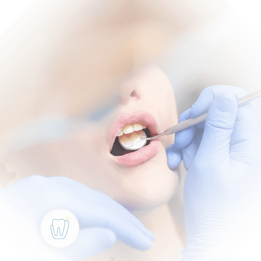 dentist looks into patients mouth with mirror during emergency diagnosis