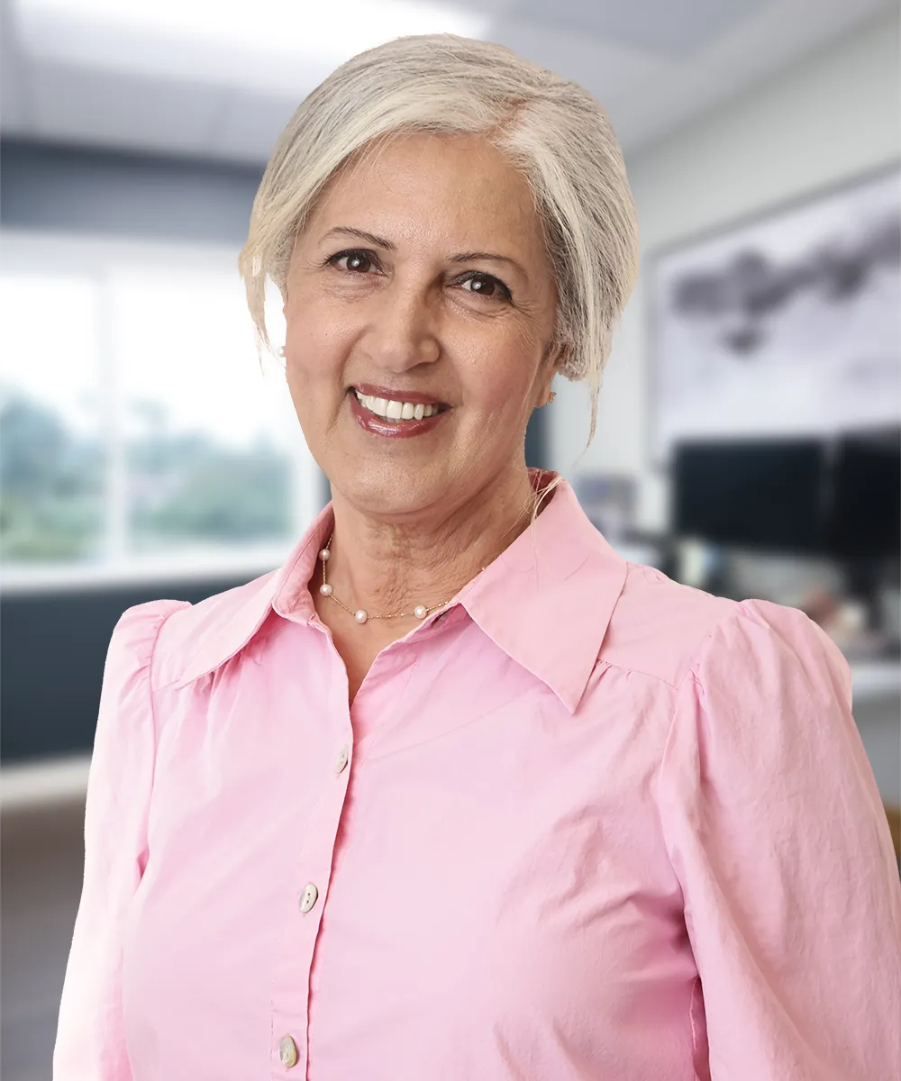 A headshot of Seta M., smiling contentedly, reflecting her positive experience at Vartanian Dental Group.