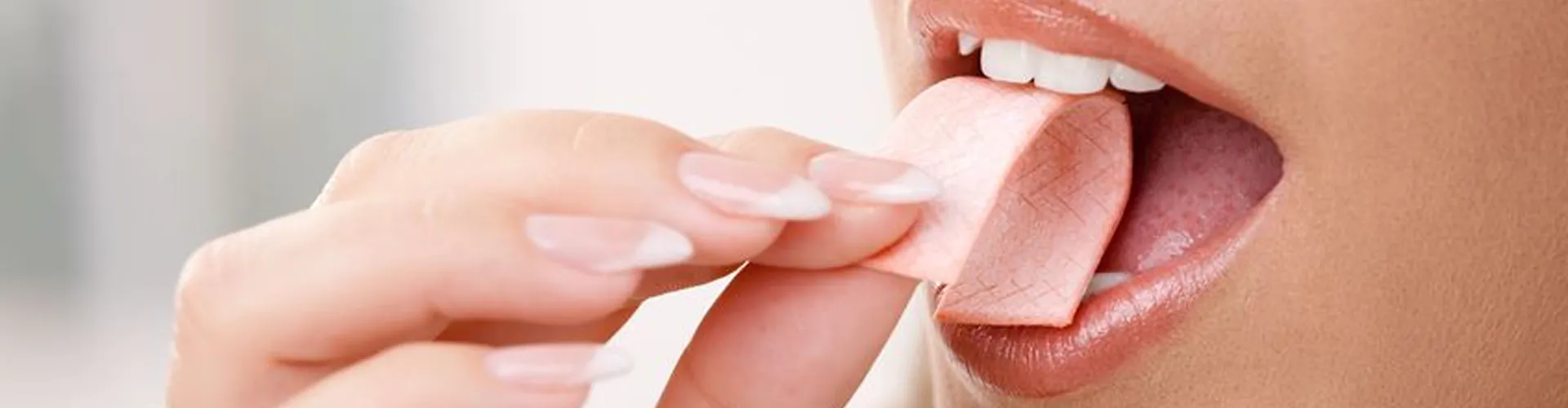 Woman eating chewing gum